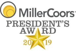 A gold star is on top of the miller coors president 's award.