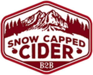 A red and white logo for snow capped cider.